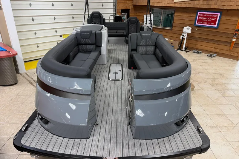 Slide: The Image of 2026 Harris Grand Mariner 250 pontoon boat with sleek gray seating and modern design. - 3