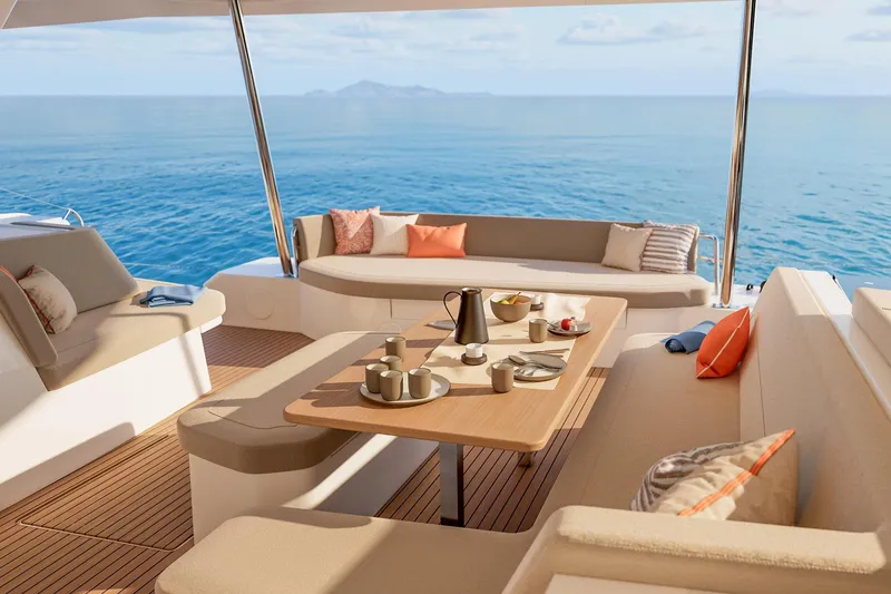 Slide: The Image of Luxurious 2026 Fountaine Pajot 48 yacht deck with elegant seating and ocean view. - 15