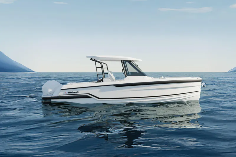 Slide: The Image of 2026 Wellcraft 28 T-Top boat on open water, sleek design, clear sky. - 13