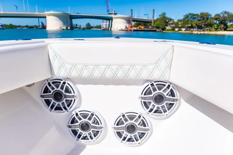 Slide: The Image of 2022 Conch 27 boat interior with speakers, bridge view, sunny day. - 16