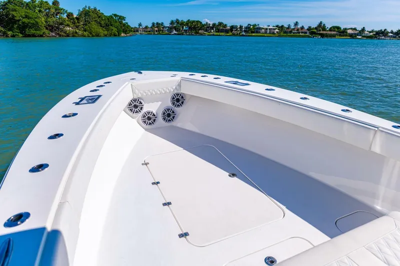 Slide: The Image of 2022 Conch 27 boat on calm water, featuring spacious deck and modern design. - 17