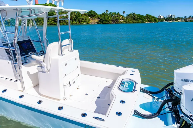 Slide: The Image of 2022 Conch 27 boat with dual Mercury engines on a sunny day. - 27