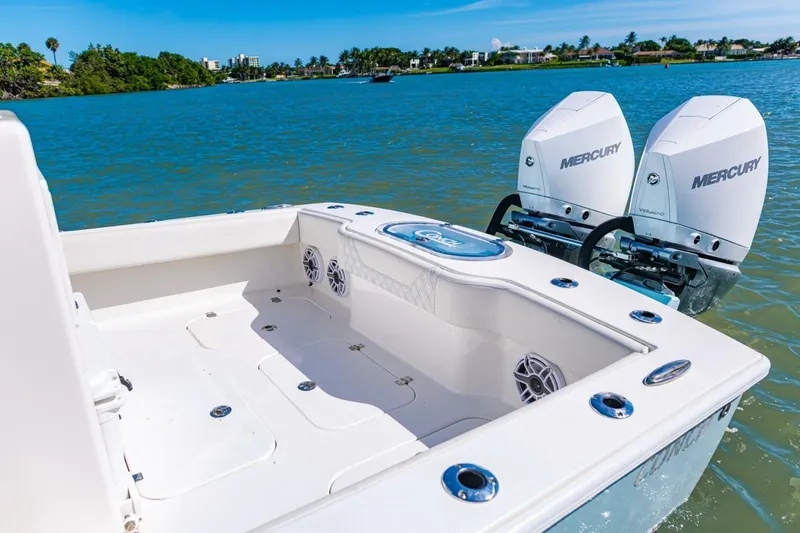 Slide: The Image of 2022 Conch 27 boat with dual Mercury engines on a sunny day. - 28