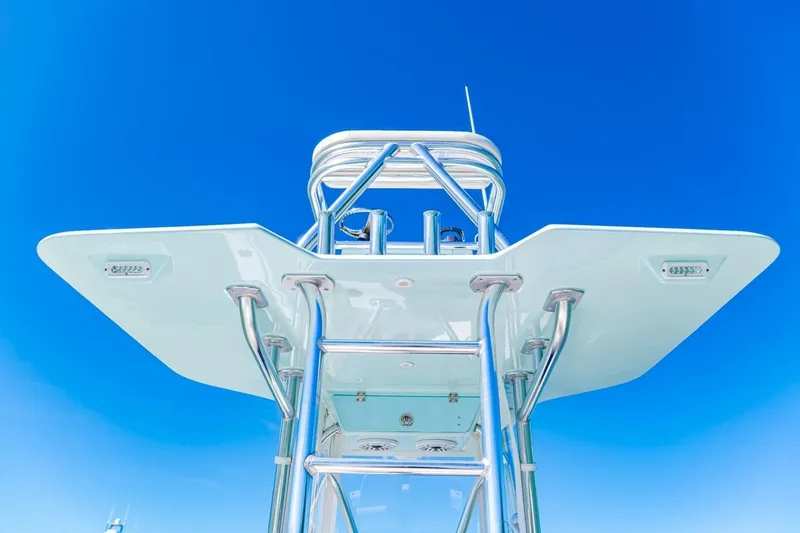 Slide: The Image of 2022 Conch 27 boat tower against clear blue sky. - 32