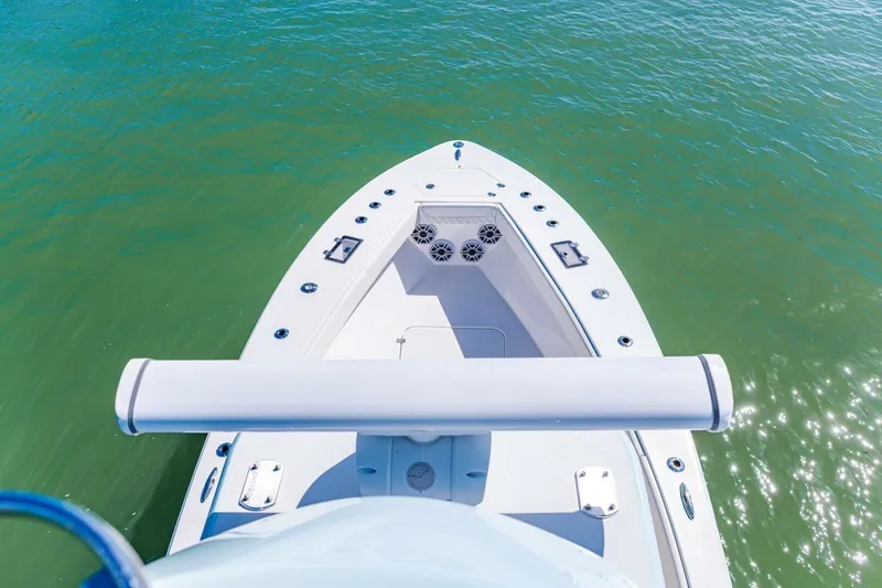 Slide: The Image of Bow view of 2022 Conch 27 boat on clear green water. - 36