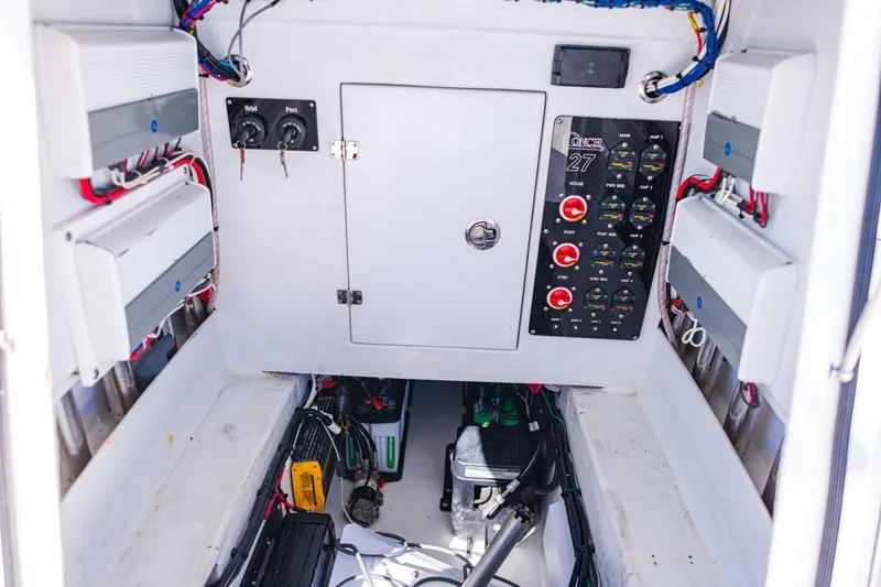 Slide: The Image of Electrical panel of a 2022 Conch 27 boat, featuring switches and wiring. - 37