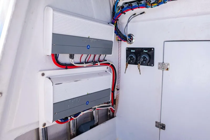 Slide: The Image of Electrical panel and wiring inside a 2022 Conch 27 boat. - 38