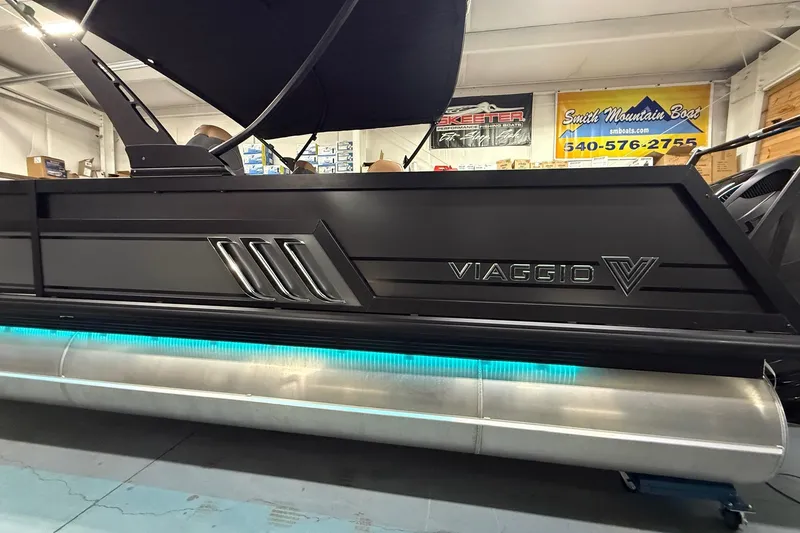The Image of 2026 Viaggio Diamante 24S pontoon boat with sleek black design and illuminated undercarriage. - 1