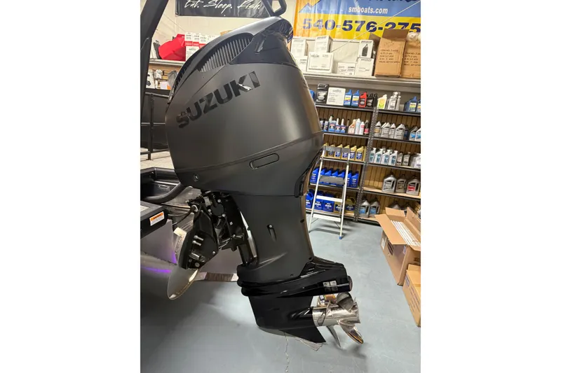 Slide: The Image of 2026 Viaggio Diamante 24S with Suzuki outboard motor in a workshop setting. - 33