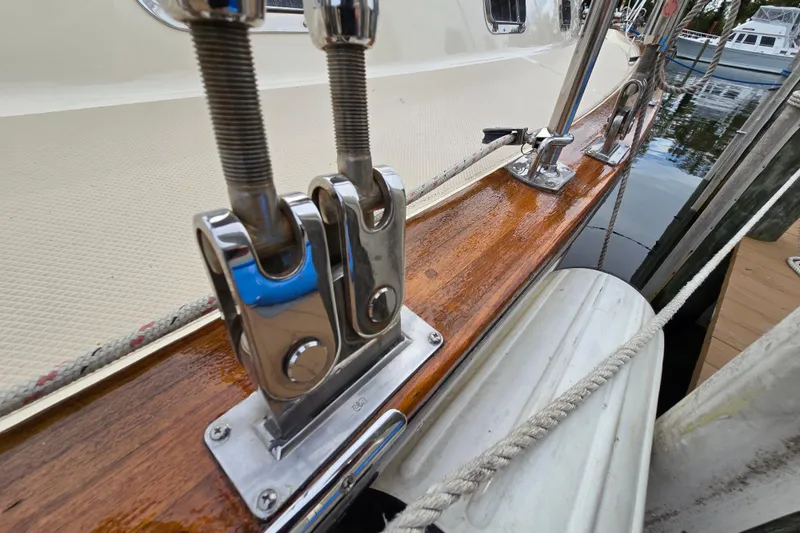 Slide: The Image of Close-up of 2001 Island Packet 420 sailboat rigging and polished wood deck. - 11