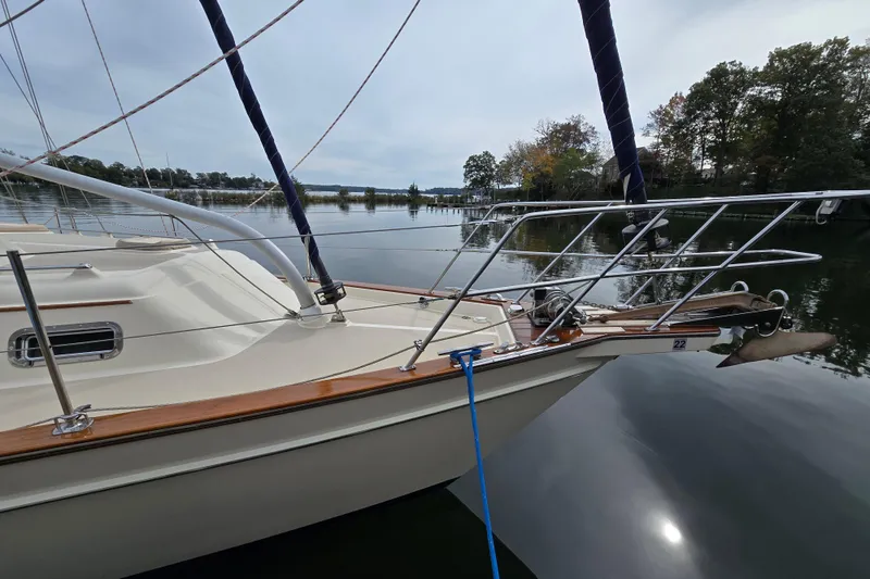 Slide: The Image of Island Packet 420 sailboat from 2001 docked on a calm lake. - 3