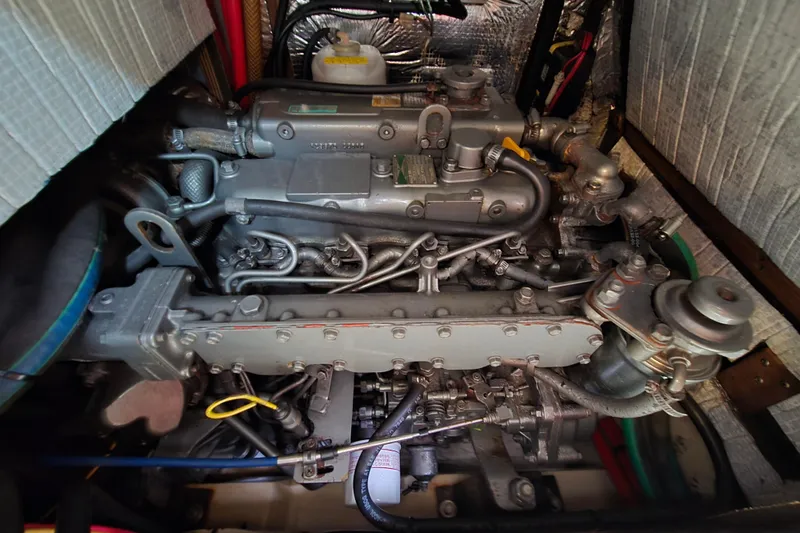Slide: The Image of Engine of a 2001 Island Packet 420 sailboat, showcasing intricate mechanical components. - 40