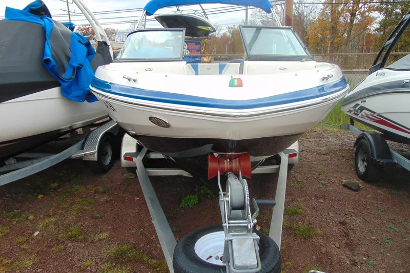 Slide: The Image of 2016 Regal 2000 ESX Bowrider on trailer, front view, parked outdoors. - 1