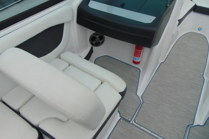 Slide: The Image of Interior of 2016 Regal 2000 ESX Bowrider with white seating and fire extinguisher. - 10