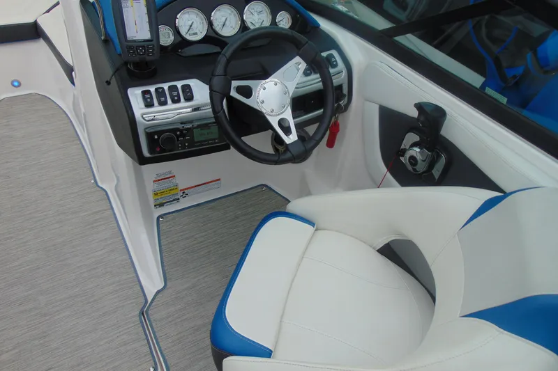 Slide: The Image of 2016 Regal 2000 ESX Bowrider cockpit with steering wheel and control panel. - 11