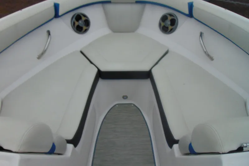 Slide: The Image of 2016 Regal 2000 ESX Bowrider interior with white cushioned seating and stainless steel accents. - 17