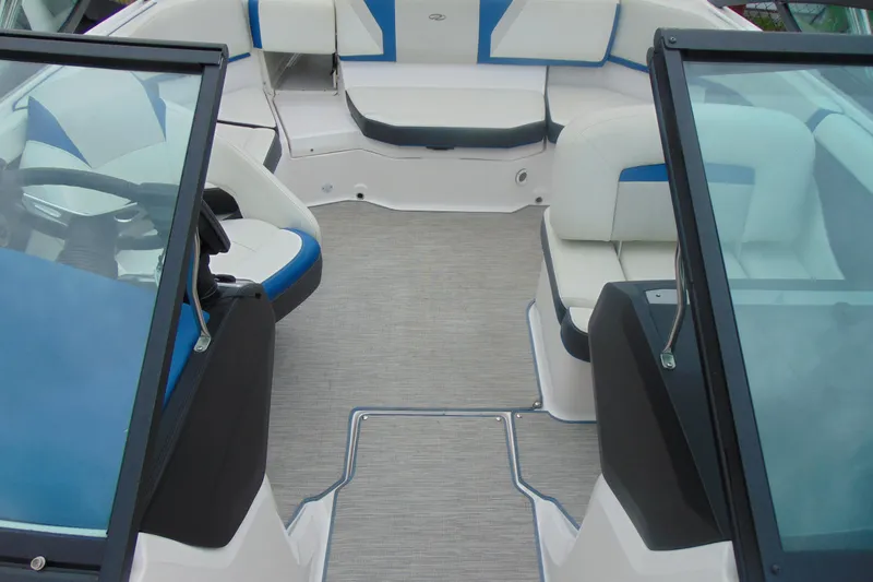 Slide: The Image of 2016 Regal 2000 ESX Bowrider interior with blue and white seating, open cockpit view. - 18
