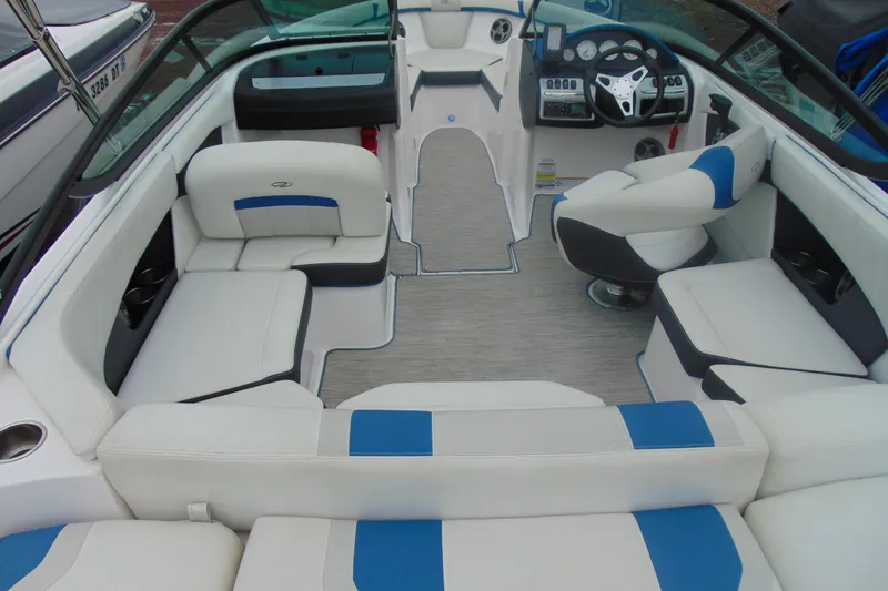 Slide: The Image of 2016 Regal 2000 ESX Bowrider interior with white and blue seating, modern dashboard. - 6