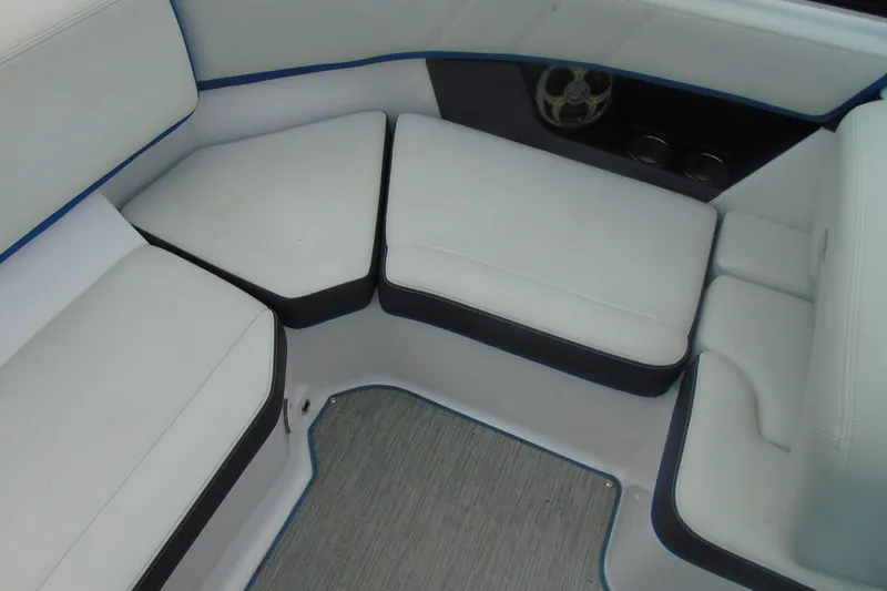 Slide: The Image of 2016 Regal 2000 ESX Bowrider interior seating with white cushions and speaker. - 8