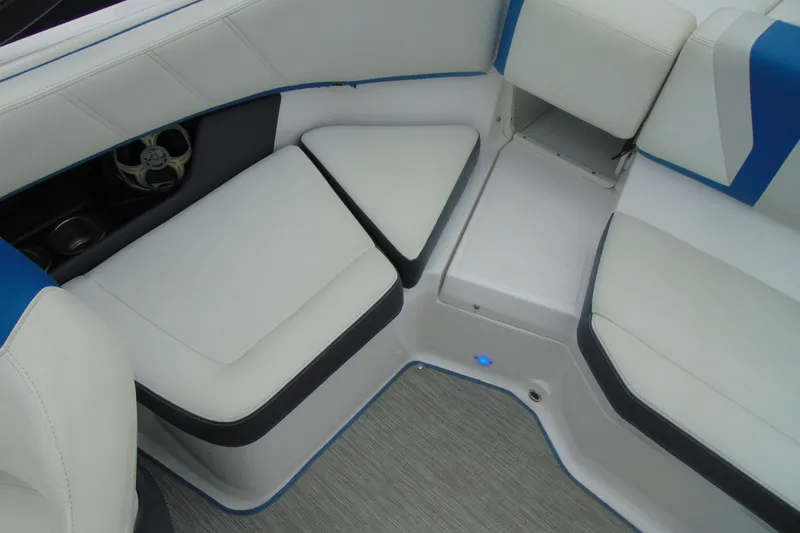 Slide: The Image of 2016 Regal 2000 ESX Bowrider interior seating with white and blue upholstery. - 9