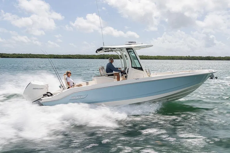 The Image of Manufacturer Provided Image: 2026 Boston Whaler 280 Dauntless cruising on open water under a partly cloudy sky. - 0