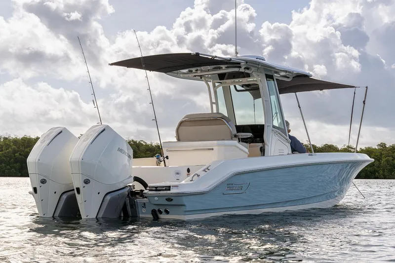 Slide: The Image of Manufacturer Provided Image: 2026 Boston Whaler 280 Dauntless boat on water, featuring dual engines and a sleek design. - 6