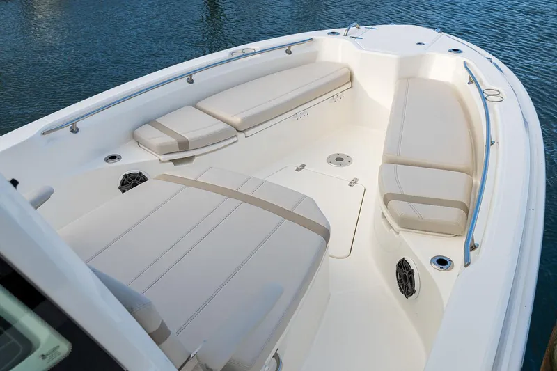 Slide: The Image of Manufacturer Provided Image: 2026 Boston Whaler 280 Dauntless boat interior with cushioned seating and sleek design. - 8