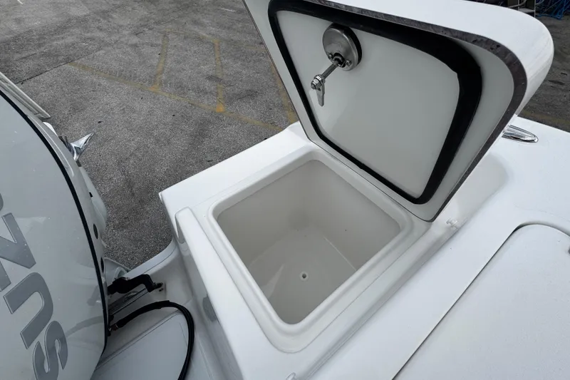 Slide: The Image of Open storage compartment on 2026 Sea Pro 240 Dual Console boat. - 26