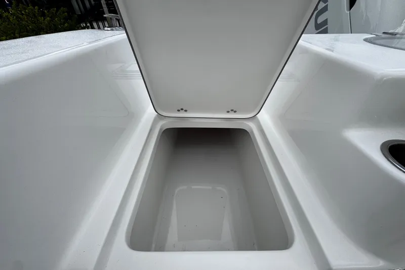 Slide: The Image of Open storage compartment on 2026 Sea Pro 240 Dual Console boat. - 30