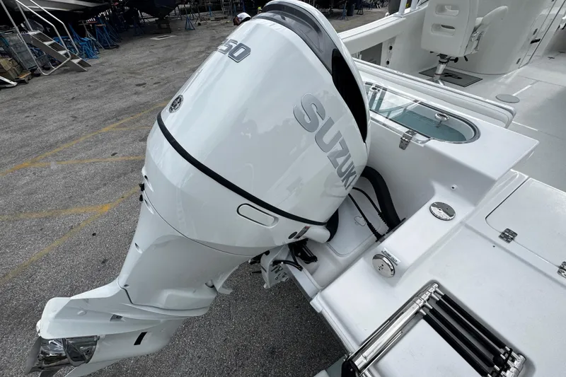 Slide: The Image of 2026 Sea Pro 240 Dual Console with Suzuki outboard motor, displayed on a trailer. - 34