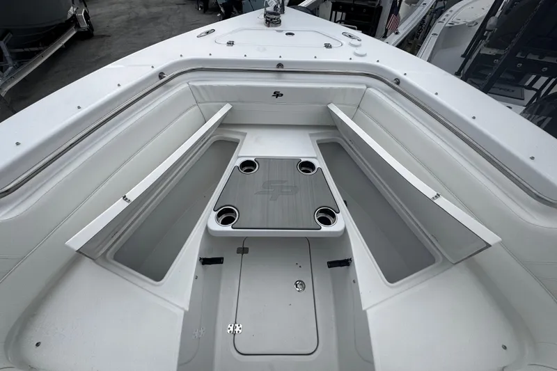 Slide: The Image of 2026 Sea Pro 240 Dual Console boat interior with seating and storage compartments. - 5