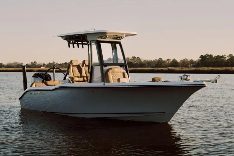 The Image of 2026 Key West 239 FSR boat on trailer under sunny sky. - 0