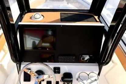 Slide: The Image of Helm of 2026 Key West 239 FSR boat with modern controls and steering wheel. - 10