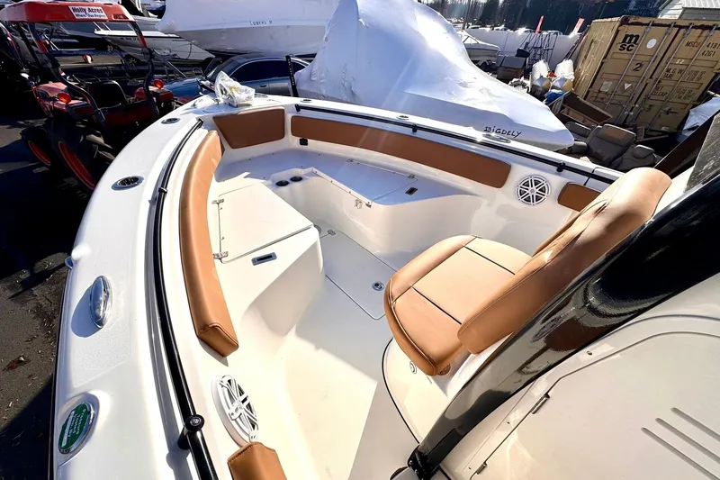 Slide: The Image of 2026 Key West 239 FSR boat interior with tan seating and modern design. - 11
