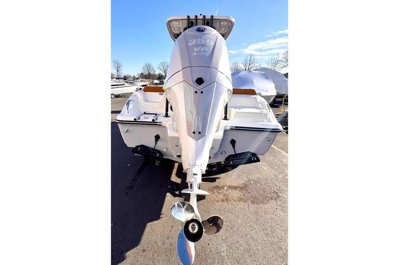 Slide: The Image of 2026 Key West 239 FSR boat with powerful 350 V8 engine, parked outdoors. - 14