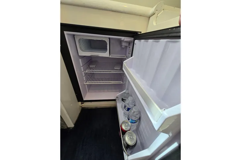 Slide: The Image of Open Giorgi 46 mini fridge, 1993 model, with drinks inside. - 105
