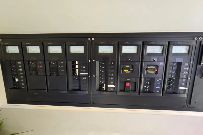 Slide: The Image of Electrical control panel of a 1993 Giorgi 46 yacht, featuring various switches and meters. - 110