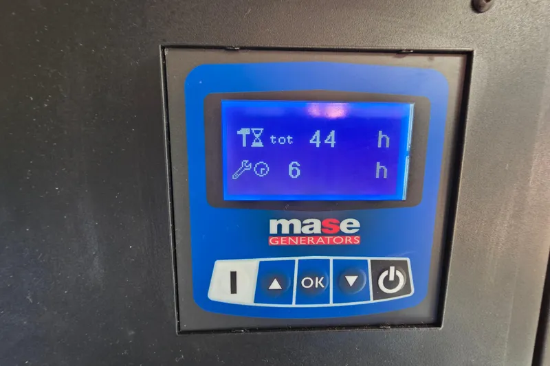 Slide: The Image of Control panel of a Mase generator displaying 44 total hours and 6 maintenance hours. - 112