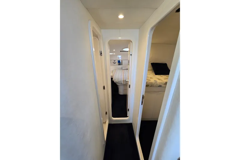 Slide: The Image of Narrow hallway inside 1993 Giorgi 46 yacht, featuring cozy cabin interiors. - 114