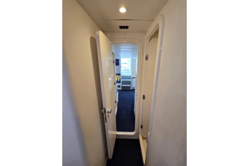 Slide: The Image of Hallway inside 1993 Giorgi 46 yacht, featuring open door and visible cabin. - 126