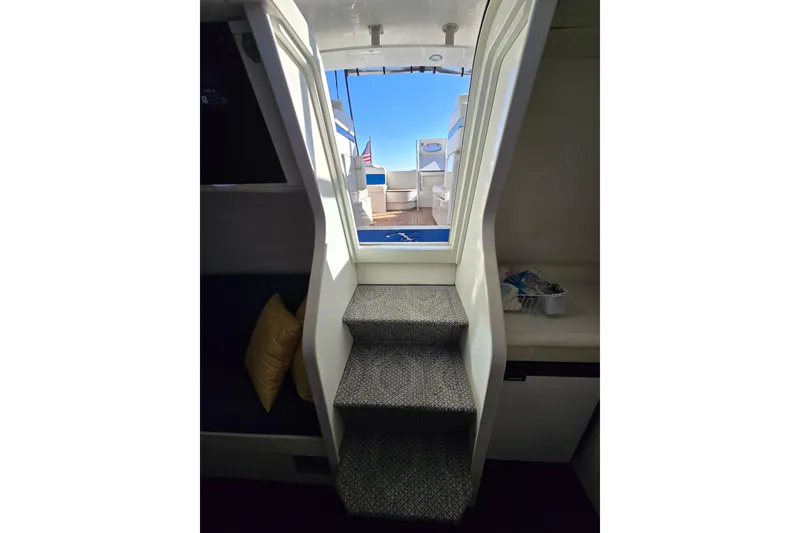 Slide: The Image of Interior view of 1993 Giorgi 46 yacht, showing stairs leading to deck with seating area. - 131