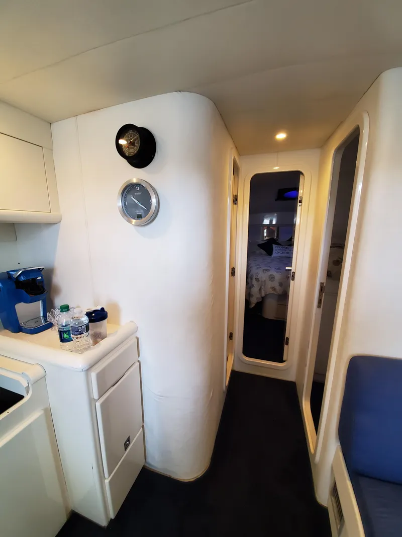 Slide: The Image of Interior of a 1993 Giorgi 46 yacht, featuring a compact hallway and modern amenities. - 14