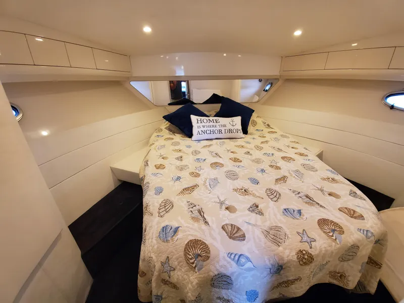Slide: The Image of Cozy cabin interior of 1993 Giorgi 46 yacht with seashell-themed bedding. - 23