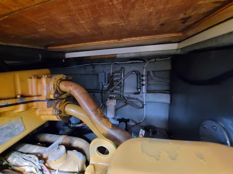 Slide: The Image of Engine compartment of a 1993 Giorgi 46, showcasing mechanical components and wiring. - 34