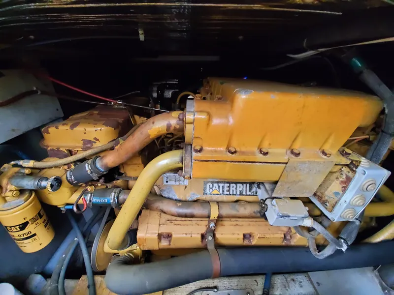 Slide: The Image of Caterpillar engine in a 1993 Giorgi 46 boat, showcasing mechanical components and piping. - 36