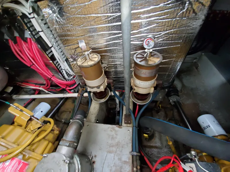 Slide: The Image of Engine room of a 1993 Giorgi 46 boat with fuel filters and wiring. - 41