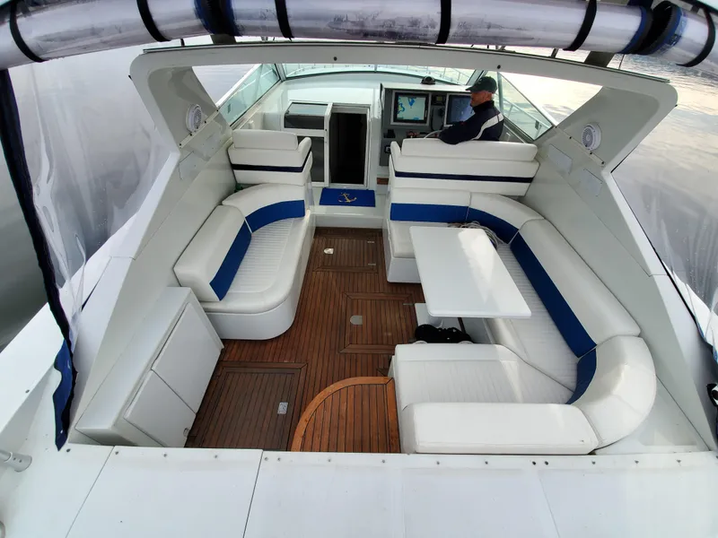 Slide: The Image of Luxurious 1993 Giorgi 46 yacht interior with white seating and wooden flooring. - 45
