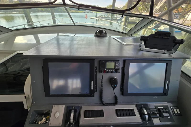 Slide: The Image of Cockpit of 1993 Giorgi 46 boat with navigation screens and controls. - 92