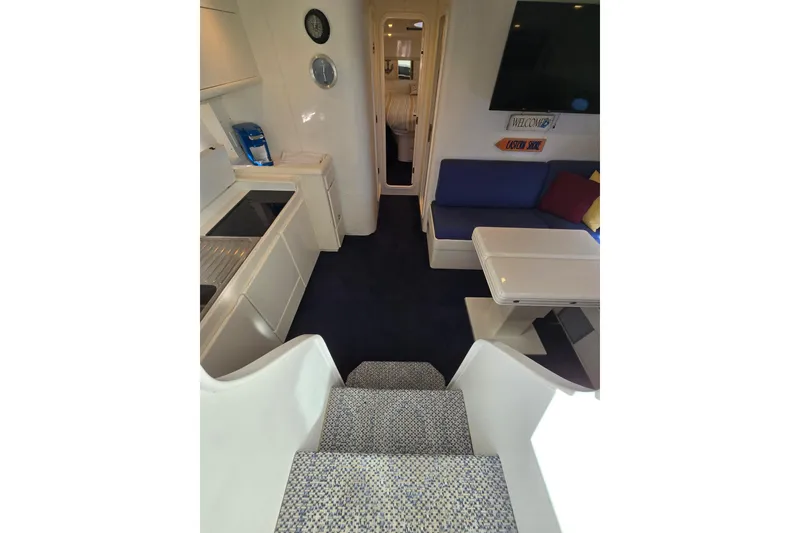 Slide: The Image of Interior of 1993 Giorgi 46 yacht with modern kitchen and cozy seating area. - 98