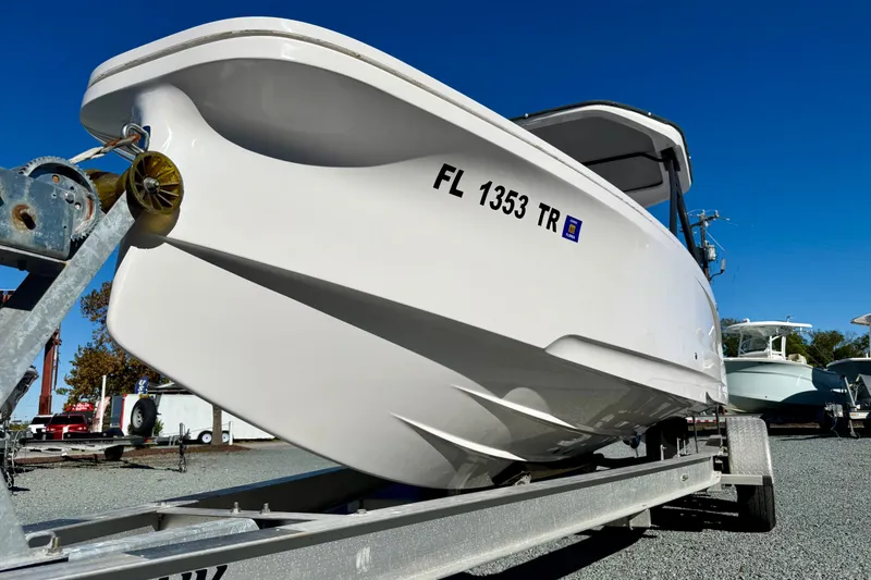 Slide: The Image of 2022 Axopar 22 boat on trailer, sunny day, close-up view. - 14